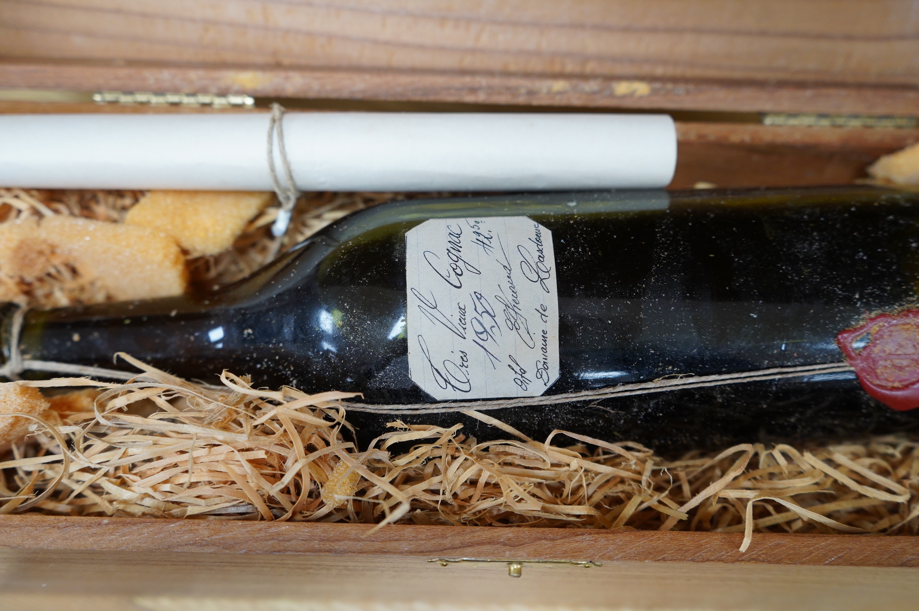 A cased bottle of Guy Lheraud ‘Tres Vieux’ Cognac, 1950 with certificate, together with a bottle of Drambuie. Condition - fair externally